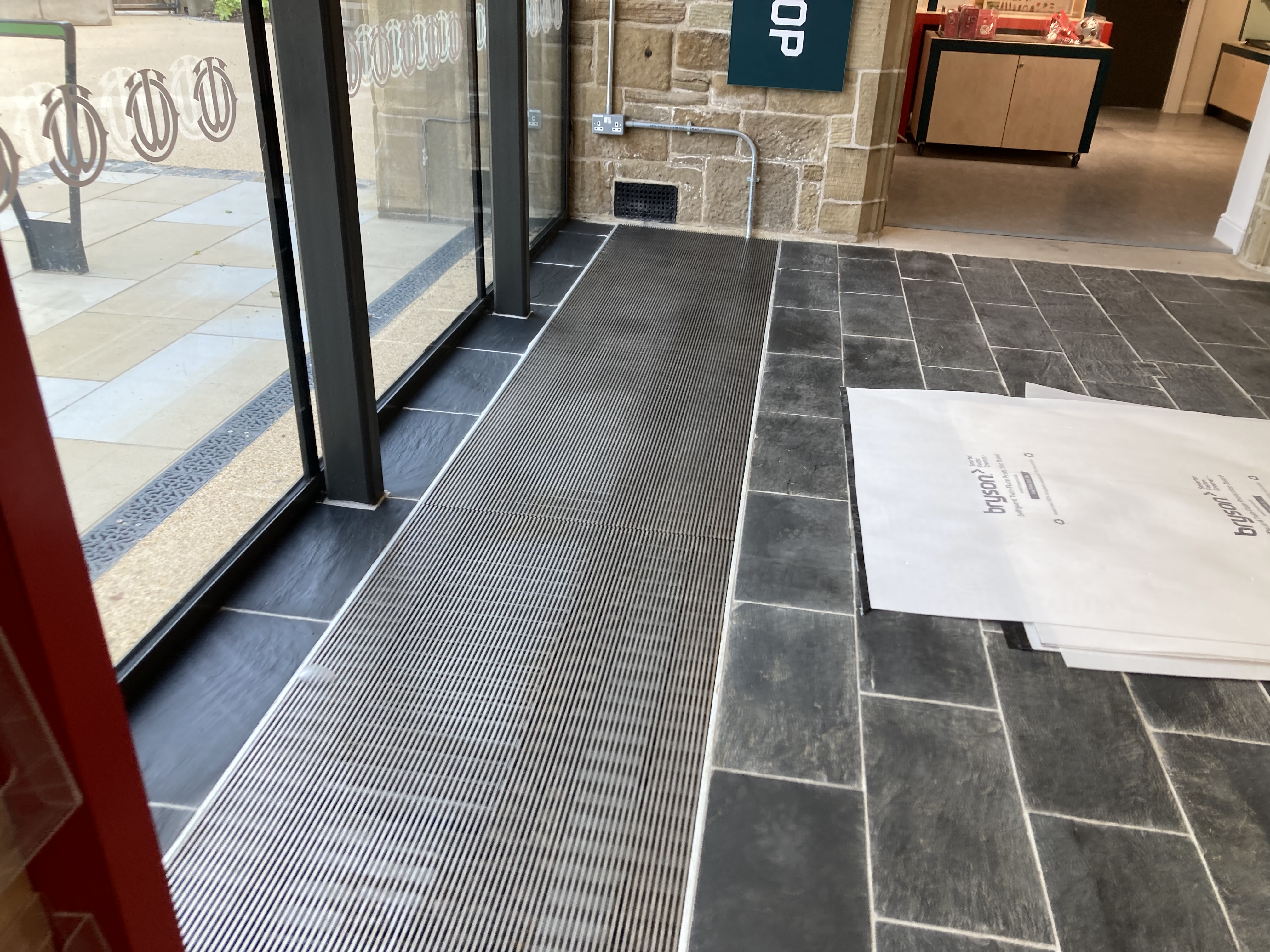 SPC Metropolitan trench heating along a glazed entrance at the Museum of Two Halves, Wrexham